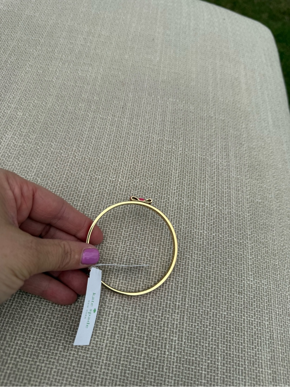 Kate Spade Gold-Tone Bracelet with Pink Enamel Bow Accent - Picture 2 of 4